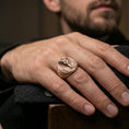 Load image into Gallery viewer, Sterling silver Egyptian king signet ring on a finger, macro lifestyle shot featuring the rose gold plated finish and detailed pharaoh headdress design
