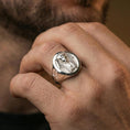 Load image into Gallery viewer, Sterling silver ancient Egypt statement ring on a finger, macro lifestyle image emphasizing the polished silver pharaoh portrait and detailed headdress engraving
