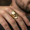 Load image into Gallery viewer, Sterling silver ancient Greek helmet ring worn on a finger, close-up lifestyle photo showcasing the gold plated finish and bold Spartan warrior motif
