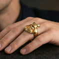 Load image into Gallery viewer, Sterling silver samurai armor statement ring worn on a finger, close-up lifestyle photo showcasing the gold plated finish and ornate helmet crest engraving
