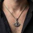 Load image into Gallery viewer, Sterling silver Viking axe pendant necklace worn on the neck, close-up lifestyle shot highlighting the oxidized finish and Vegvisir compass symbol
