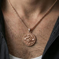 Load image into Gallery viewer, Sterling silver dragon medallion pendant necklace on the neck, macro lifestyle shot showcasing the rose gold plated finish and ornate dragon design
