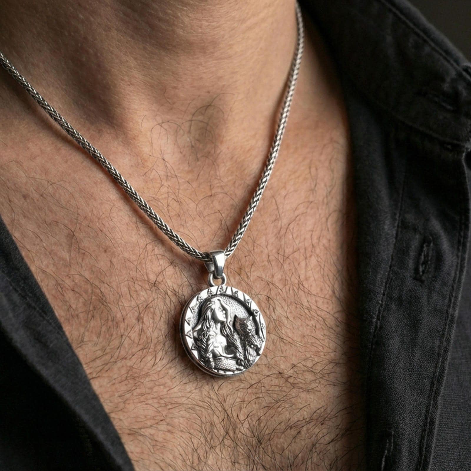 Sterling silver Freya pendant necklace on the neck, macro lifestyle image showing the polished silver finish and detailed goddess portrait