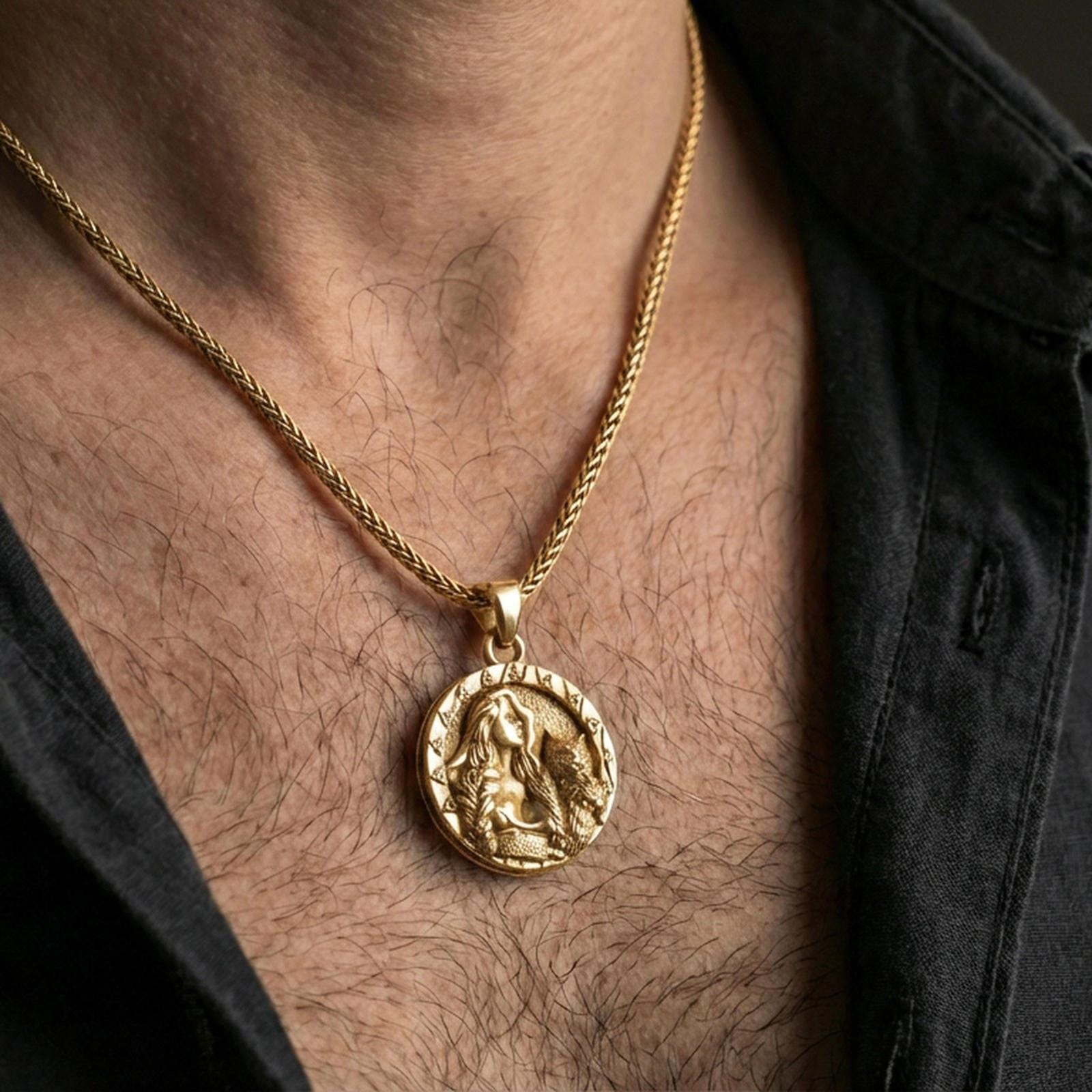 Sterling silver Freya goddess medallion worn on the neck, close-up lifestyle photo featuring the gold plated finish and Nordic amulet design