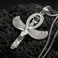 Load image into Gallery viewer, Sterling silver winged Isis pendant in a polished silver finish, Egyptian goddess amulet with detailed feather wings and oval cartouche motif, macro on volcanic stone
