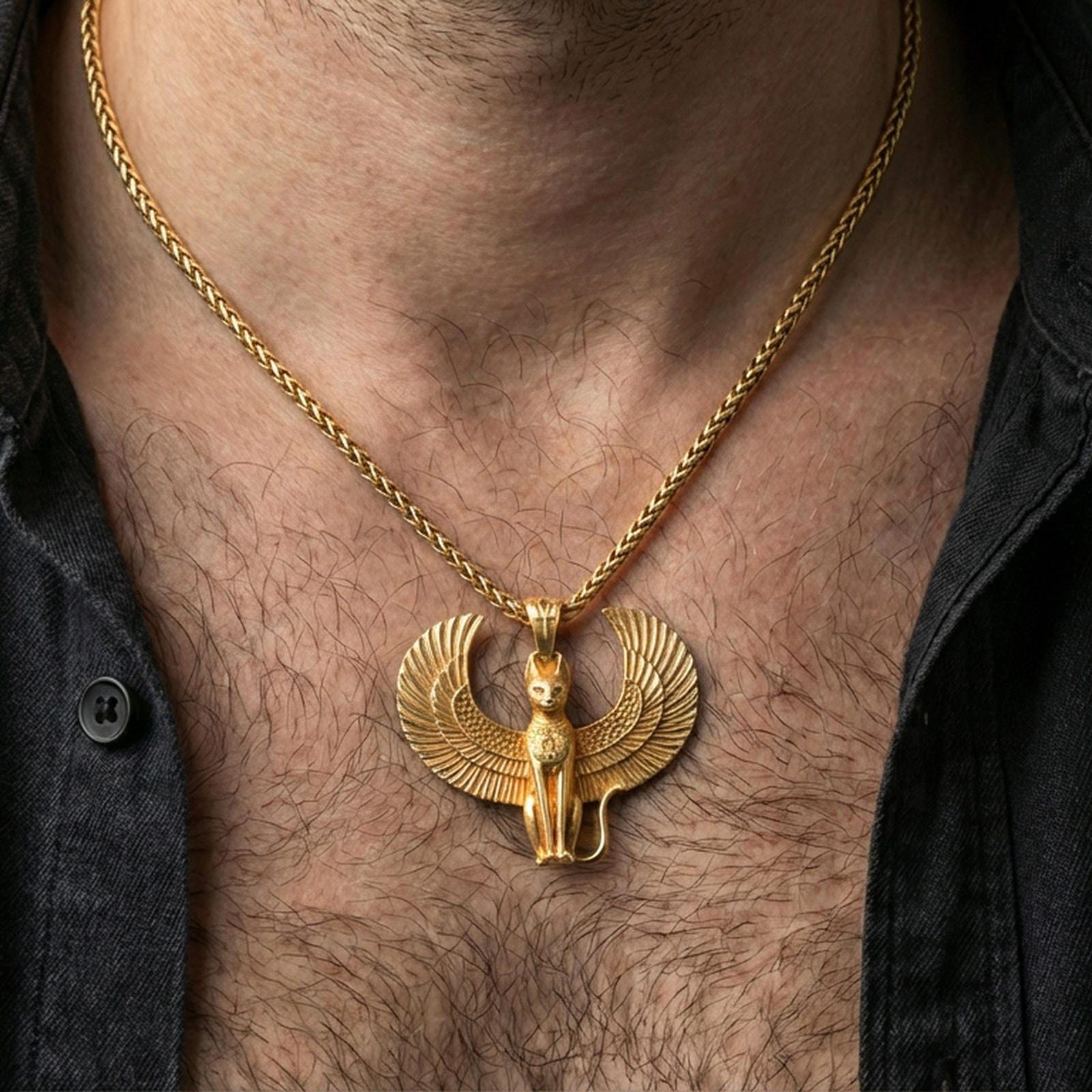 Sterling silver winged cat pendant worn on the neck, close-up lifestyle photo featuring the gold plated finish and wide feathered wings