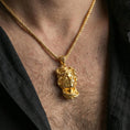 Load image into Gallery viewer, Gold plated Medusa head pendant necklace worn on the neck, lifestyle wear photo with warm tone shine and bold statement pendant presence.
