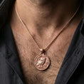Load image into Gallery viewer, Rose gold plated owl coin pendant necklace worn on the neck, lifestyle wear shot with elegant rosy shine and crisp owl engraving visible.
