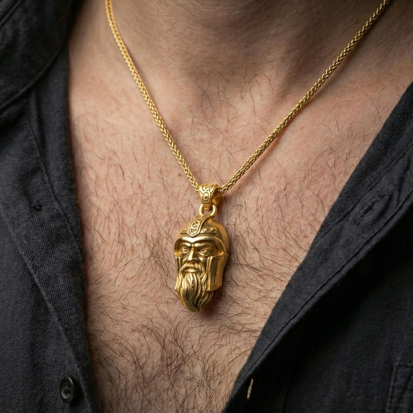 Gold plated Odin pendant necklace worn on the neck, lifestyle photo featuring warm tone finish and strong statement pendant presence.