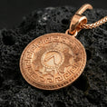 Load image into Gallery viewer, Rose gold plated Spartan shield medallion pendant necklace on textured volcanic rock, centered studio-style close-up showcasing soft rosy glow and detailed ancient Greek patterning.
