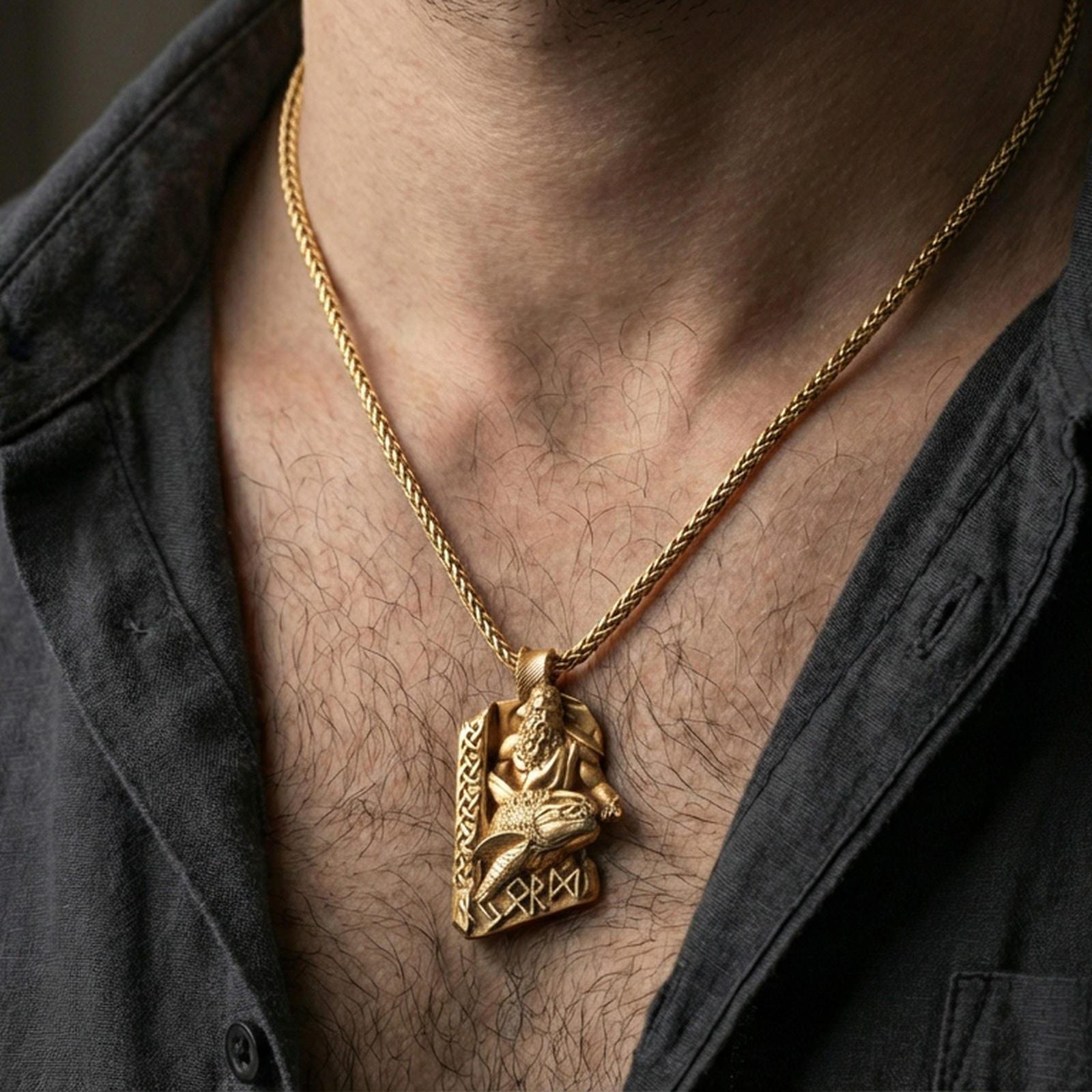 Gold plated Njord Norse sea god pendant necklace worn on the neck, lifestyle photo featuring warm tone finish and strong statement Viking amulet presence.