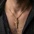 Load image into Gallery viewer, Gold plated Gungnir spear pendant necklace worn on the neck, lifestyle photo featuring warm tone finish and strong statement amulet presence.

