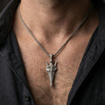 Load image into Gallery viewer, Oxidized Gungnir spear pendant necklace worn on the neck, lifestyle framing showing realistic scale and bold vintage contrast against the chest.
