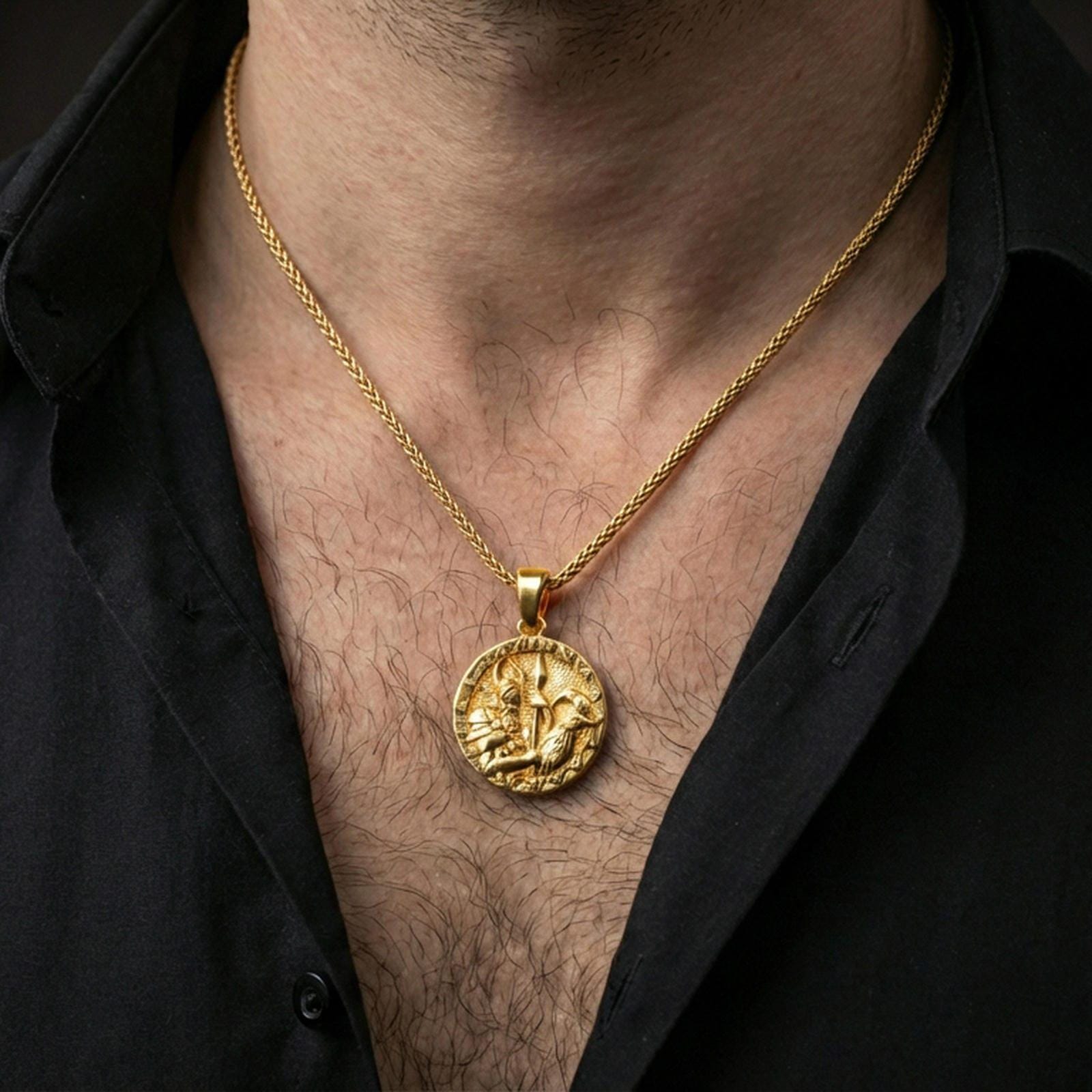 Gold plated Odin and raven medallion pendant necklace worn on the neck, lifestyle photo featuring warm tone finish and strong statement Viking medallion presence.
