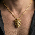 Load image into Gallery viewer, Gold plated oni mask pendant necklace worn on the neck, lifestyle photo featuring warm tone finish and strong statement pendant presence.
