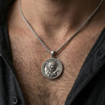 Load image into Gallery viewer, Oxidized imperial guardian lion pendant necklace worn on the neck, lifestyle framing showing realistic scale and bold vintage contrast against the chest.
