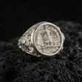 Load image into Gallery viewer, Polished silver SPQR coin style ring on textured volcanic stone, macro focus on the roman eagle emblem
