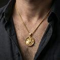 Load image into Gallery viewer, Gold plated koi fish medallion pendant necklace worn on the neck, lifestyle photo featuring warm tone finish and strong statement medallion presence.
