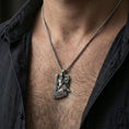 Load image into Gallery viewer, Oxidized Freyr and Gullinbursti pendant necklace worn on the neck, lifestyle framing showing realistic scale and bold vintage contrast against the chest.
