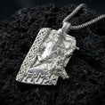 Load image into Gallery viewer, Polished silver Freyr and Gullinbursti pendant necklace on textured volcanic rock, crisp macro product photo emphasizing clean edges, sharp sculpted details on the axe and boar fur texture, and bright reflective highlights.
