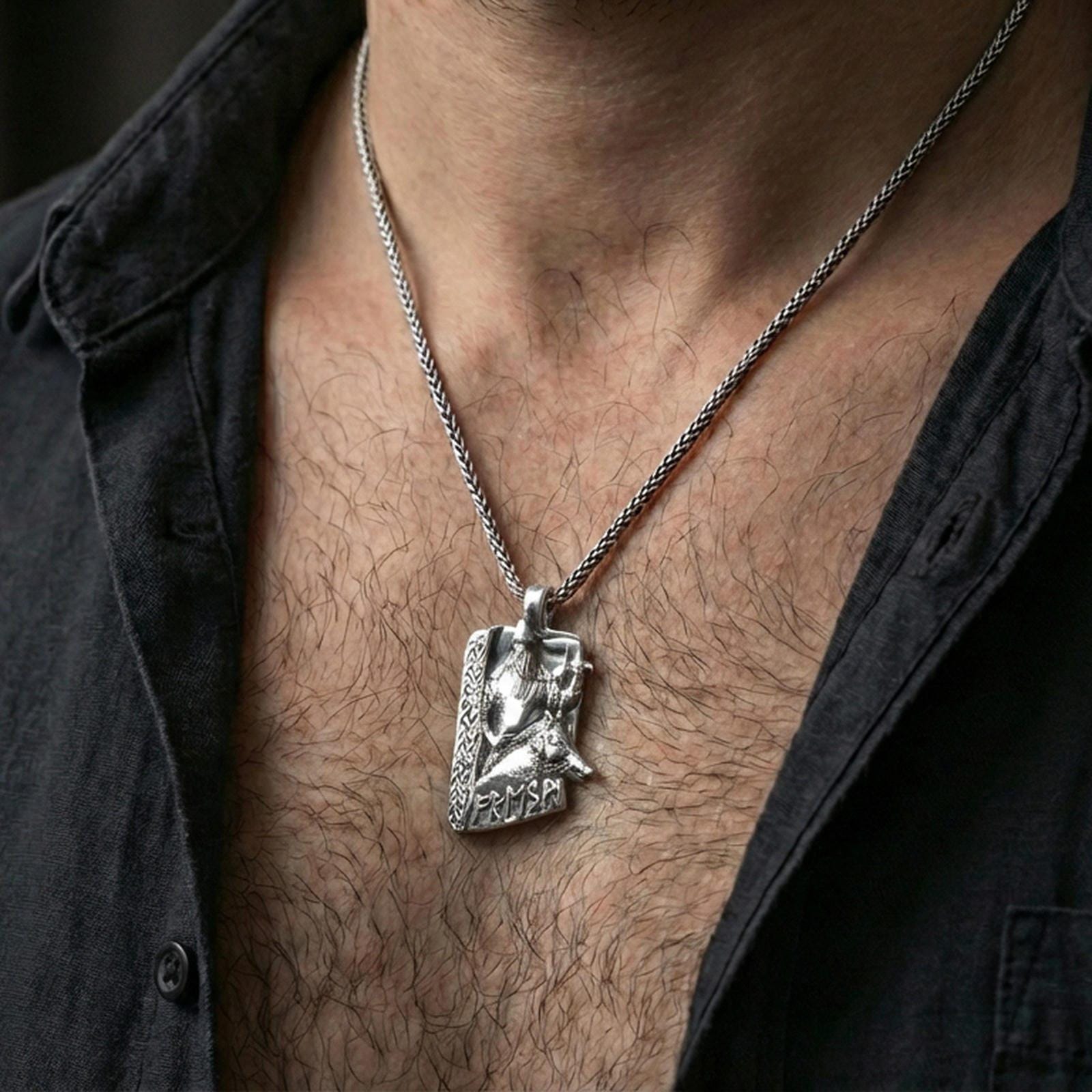 Polished silver Freyr and Gullinbursti pendant necklace worn on the neck, clean lifestyle wear shot capturing bright shine and the detailed Norse god-and-boar relief in natural light.