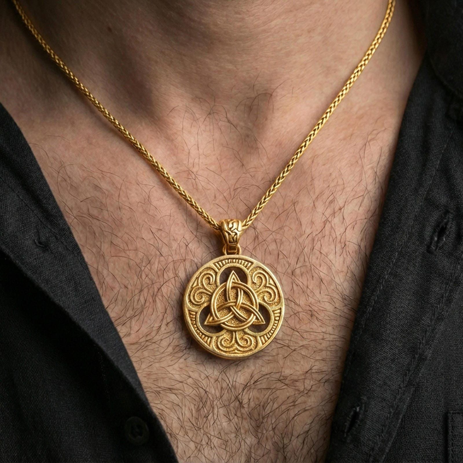 Gold plated Celtic triquetra pendant necklace worn on the neck, lifestyle photo featuring warm tone finish and strong statement amulet presence.