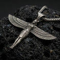 Load image into Gallery viewer, Oxidized winged Isis goddess pendant necklace on textured volcanic rock, centered close-up highlighting the spread wings, feather lines, and deep antique shadowed contrast.
