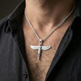 Load image into Gallery viewer, Polished silver winged Isis goddess pendant necklace worn on the neck, clean lifestyle wear shot capturing bright shine and the detailed feather relief in natural light.
