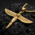 Load image into Gallery viewer, Gold plated winged Isis goddess pendant necklace on textured volcanic rock, premium close-up with warm reflective shine across the wings, body contours, and engraved textures.
