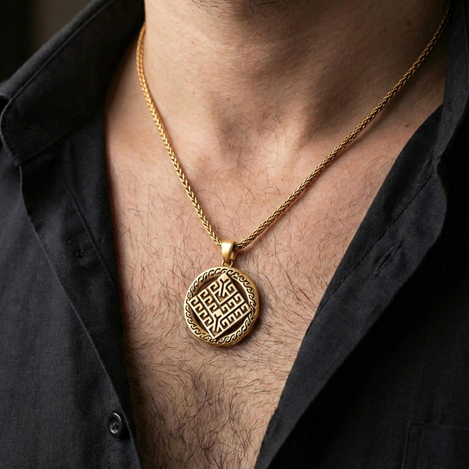 Gold plated geometric rune-style medallion pendant necklace worn on the neck, lifestyle photo featuring warm tone finish and strong statement talisman presence.