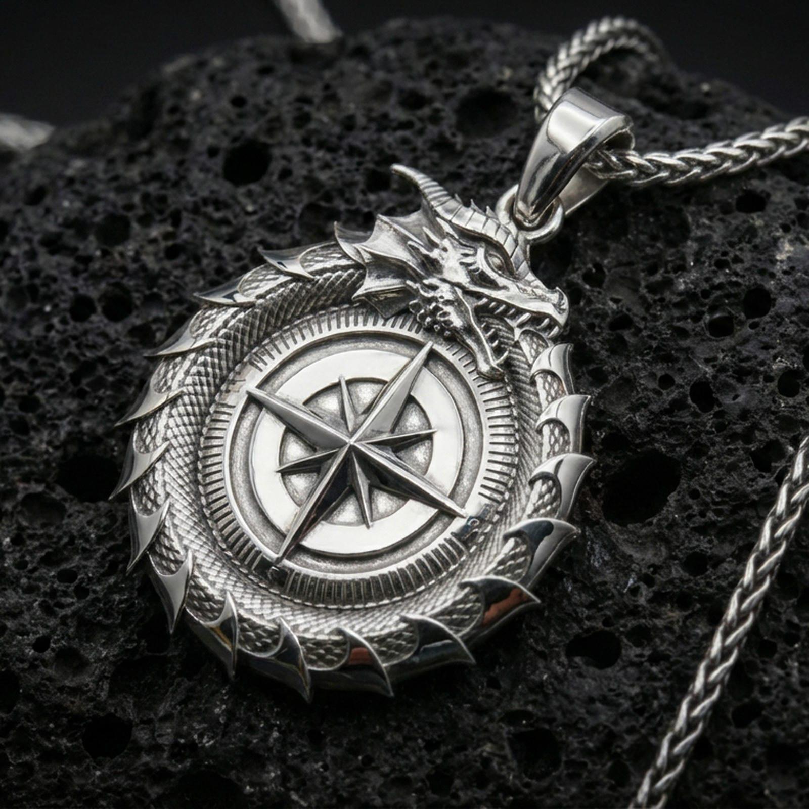 Polished silver dragon ouroboros compass necklace on volcanic stone, macro lighting highlighting the scaled coil details