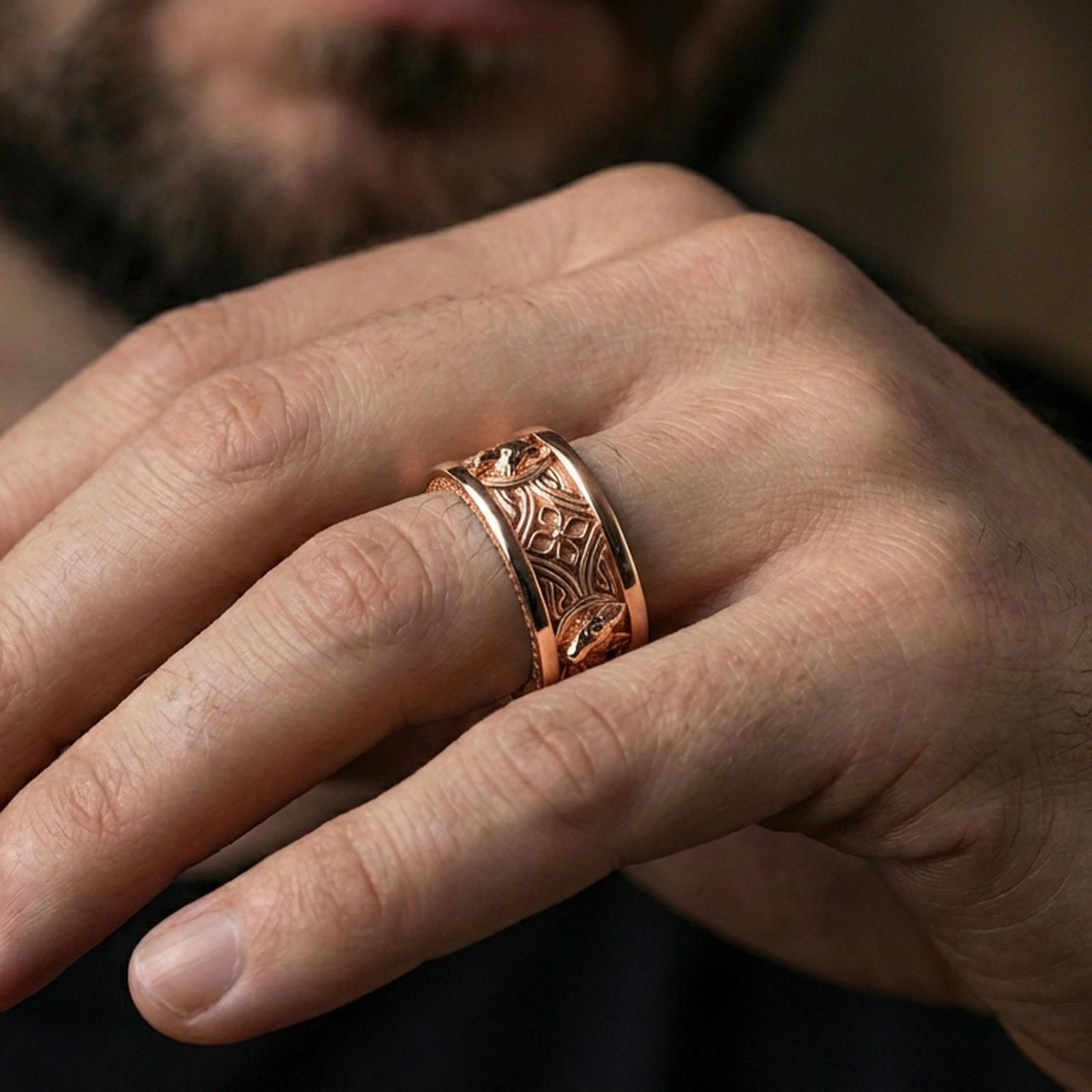Rose gold plated fox band ring worn on a finger, lifestyle wear shot with elegant rosy shine and crisp engraved fox detailing visible.