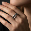 Load image into Gallery viewer, Oxidized snake wrap ring worn on a finger, lifestyle framing showing realistic scale and bold vintage contrast in a natural hand pose.

