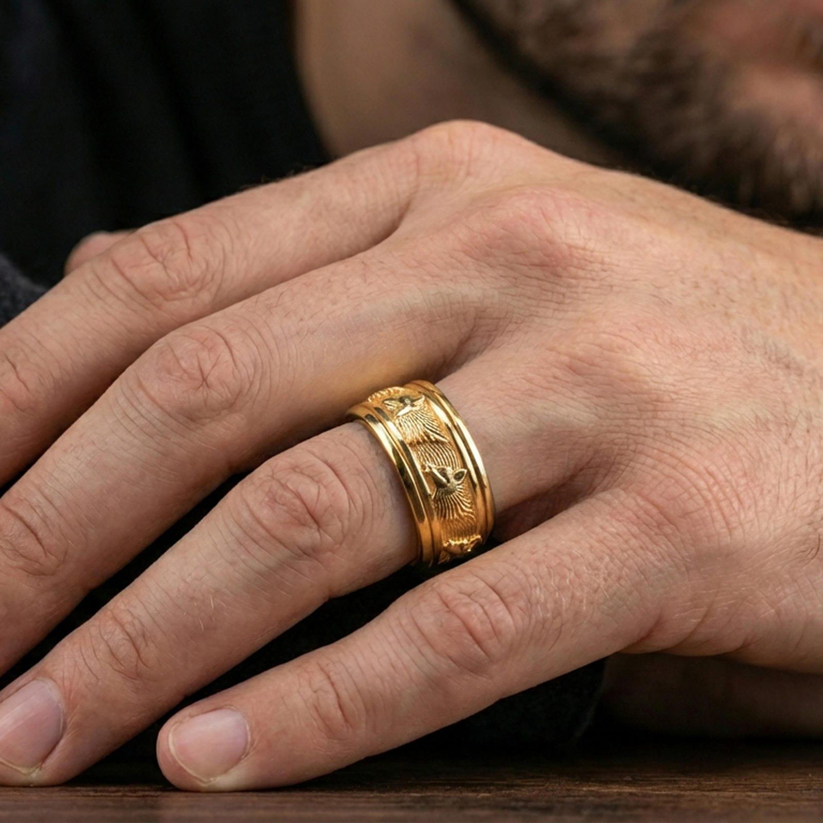 Gold plated wolf head band ring worn on a finger, lifestyle photo featuring warm tone finish and strong statement band presence.