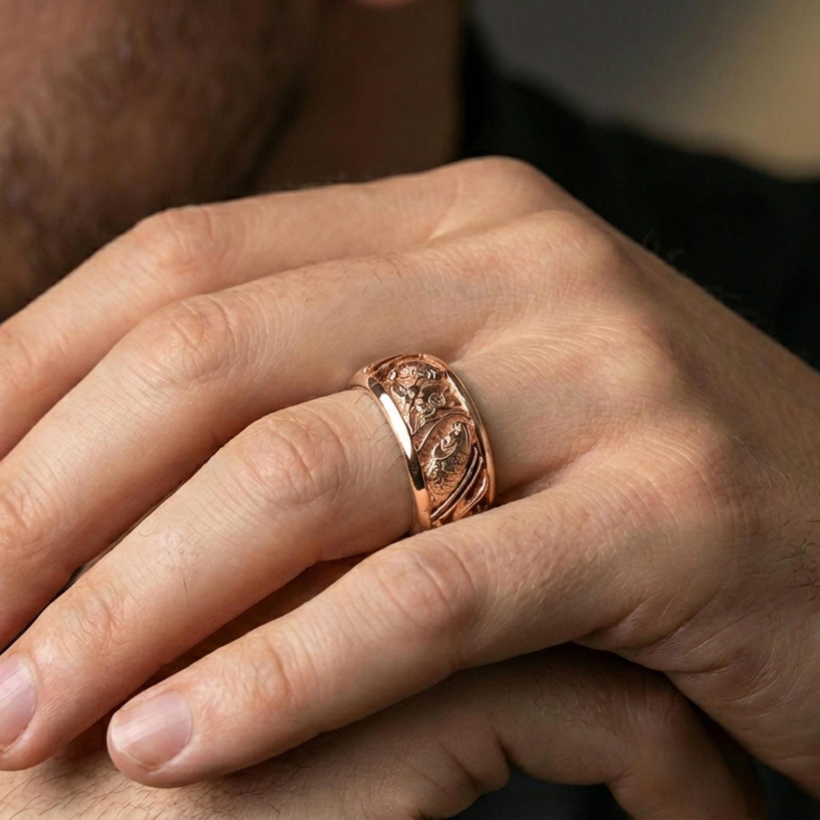 Rose gold plated koi fish and lotus band ring worn on a finger, lifestyle wear shot with elegant rosy shine and crisp koi-and-lotus detailing visible.