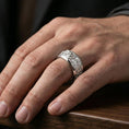 Load image into Gallery viewer, Polished silver oriental dragon band ring worn on a finger, clean lifestyle wear shot capturing bright shine and the detailed dragon relief in natural light.
