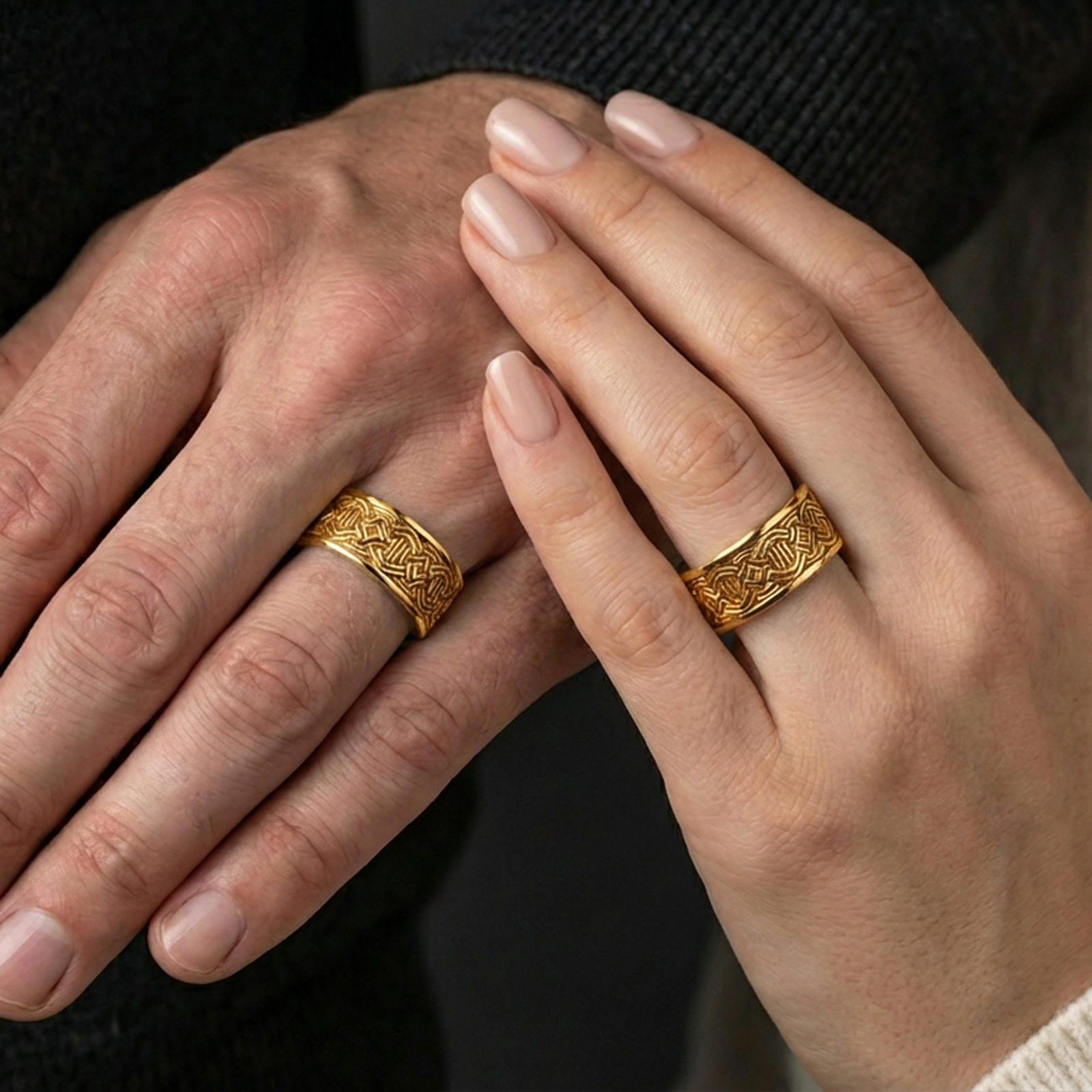 Polished silver geometric knotwork band ring worn on a finger, clean lifestyle wear shot capturing bright shine and the detailed interlace pattern in natural light.