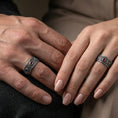 Load image into Gallery viewer, Oxidized ornate gemstone band ring worn on a finger, lifestyle wear shot showing the vintage contrast and the three-color gemstone lineup in a natural hand pose.
