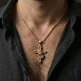 Load image into Gallery viewer, Rose gold plated praying hands cross pendant necklace on neck, close-up lifestyle photo showcasing the sculpted hands, rosary detail, and warm tone
