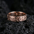 Load image into Gallery viewer, Rose gold plated geometric circle pattern ring on volcanic stone, refined close-up featuring soft rose highlights and the layered circle relief details.
