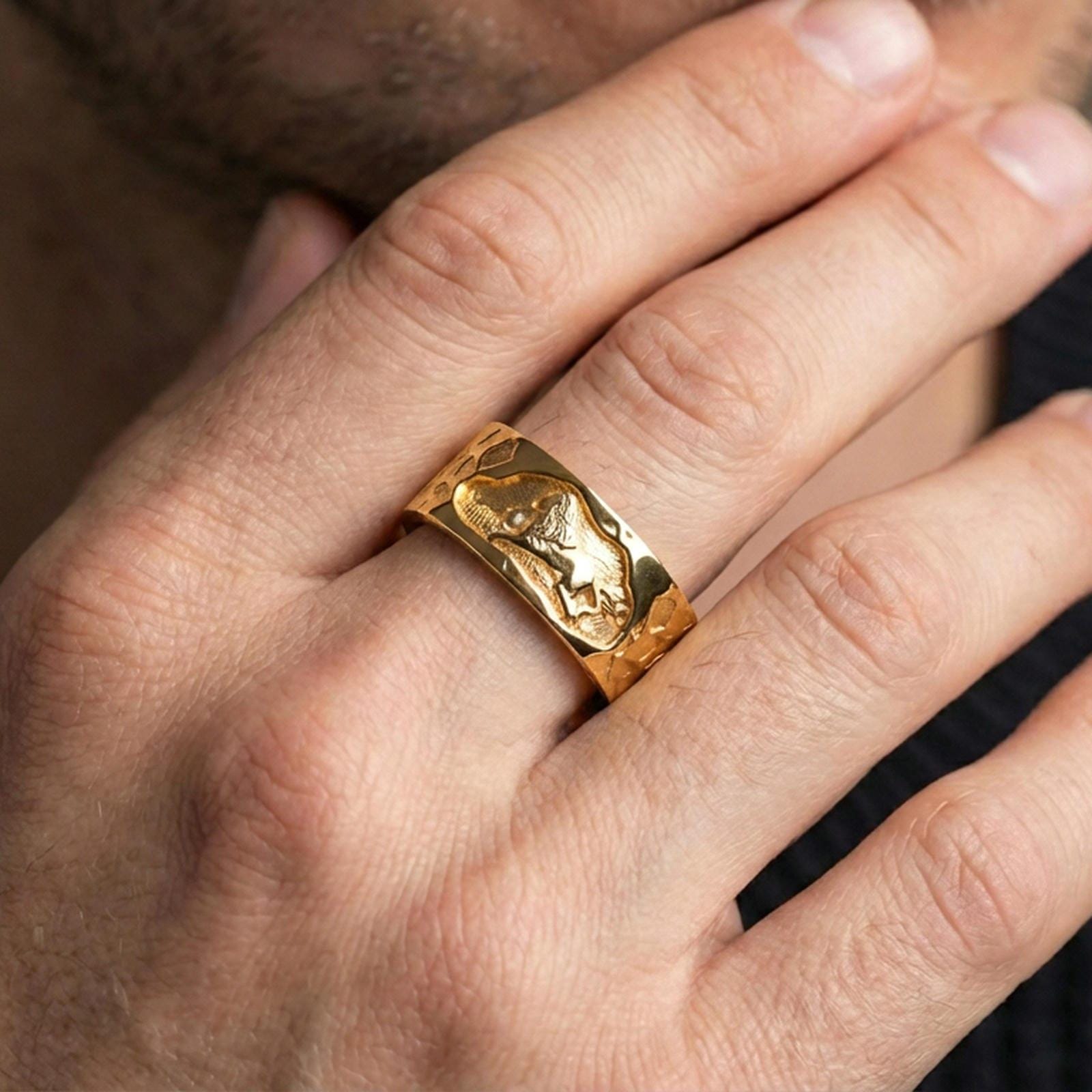 Gold plated lion band ring worn on the finger, lifestyle photo emphasizing luxury warmth, statement presence, and gift-ready appeal.