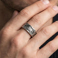 Load image into Gallery viewer, Oxidized sterling silver lion band ring worn on the finger, lifestyle image focusing on bold antique depth, lion symbolism of courage, and daily wear impact.
