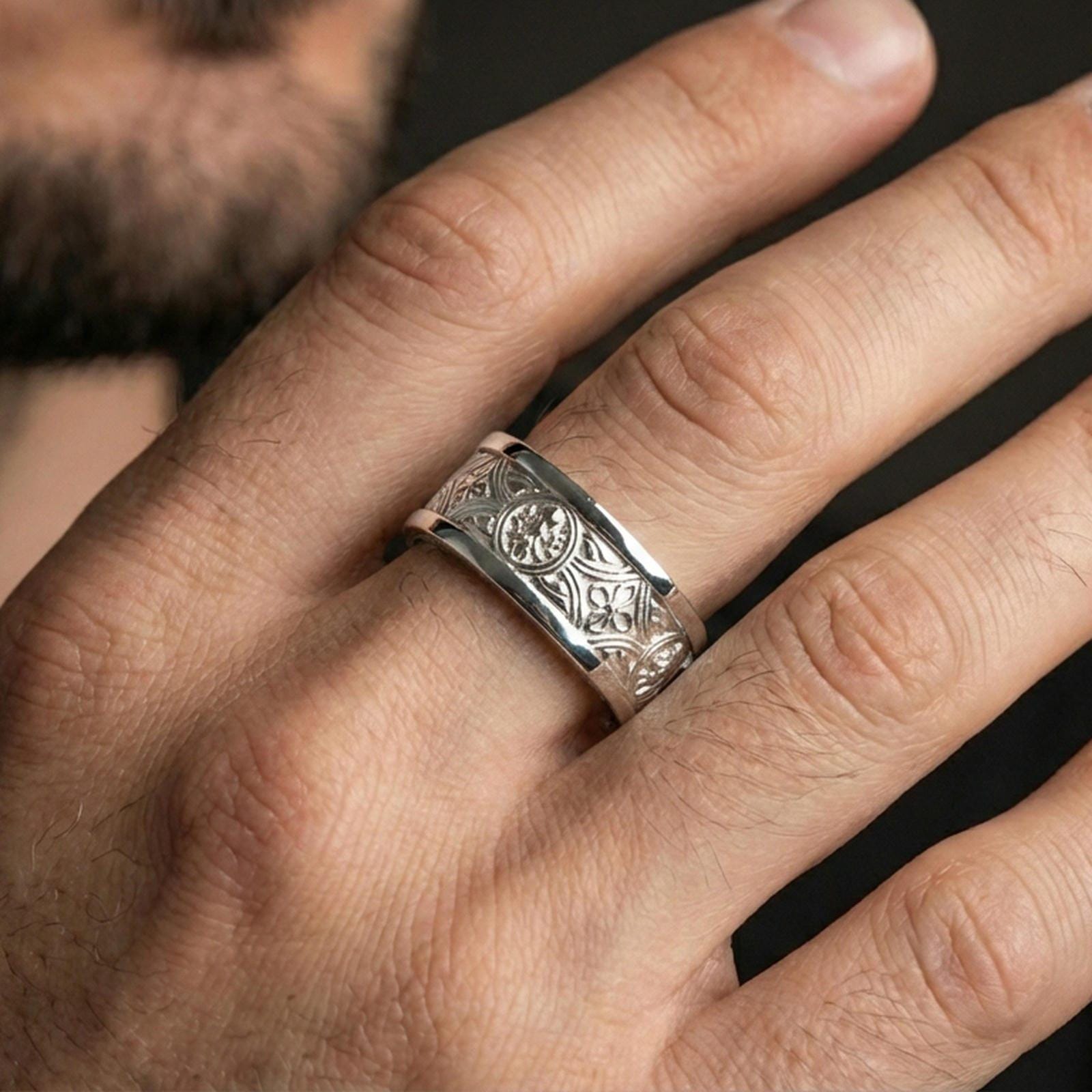 Polished silver spinner ring worn on the finger, lifestyle shot highlighting bright shine, comfortable band profile, and modern unisex wear appeal.
