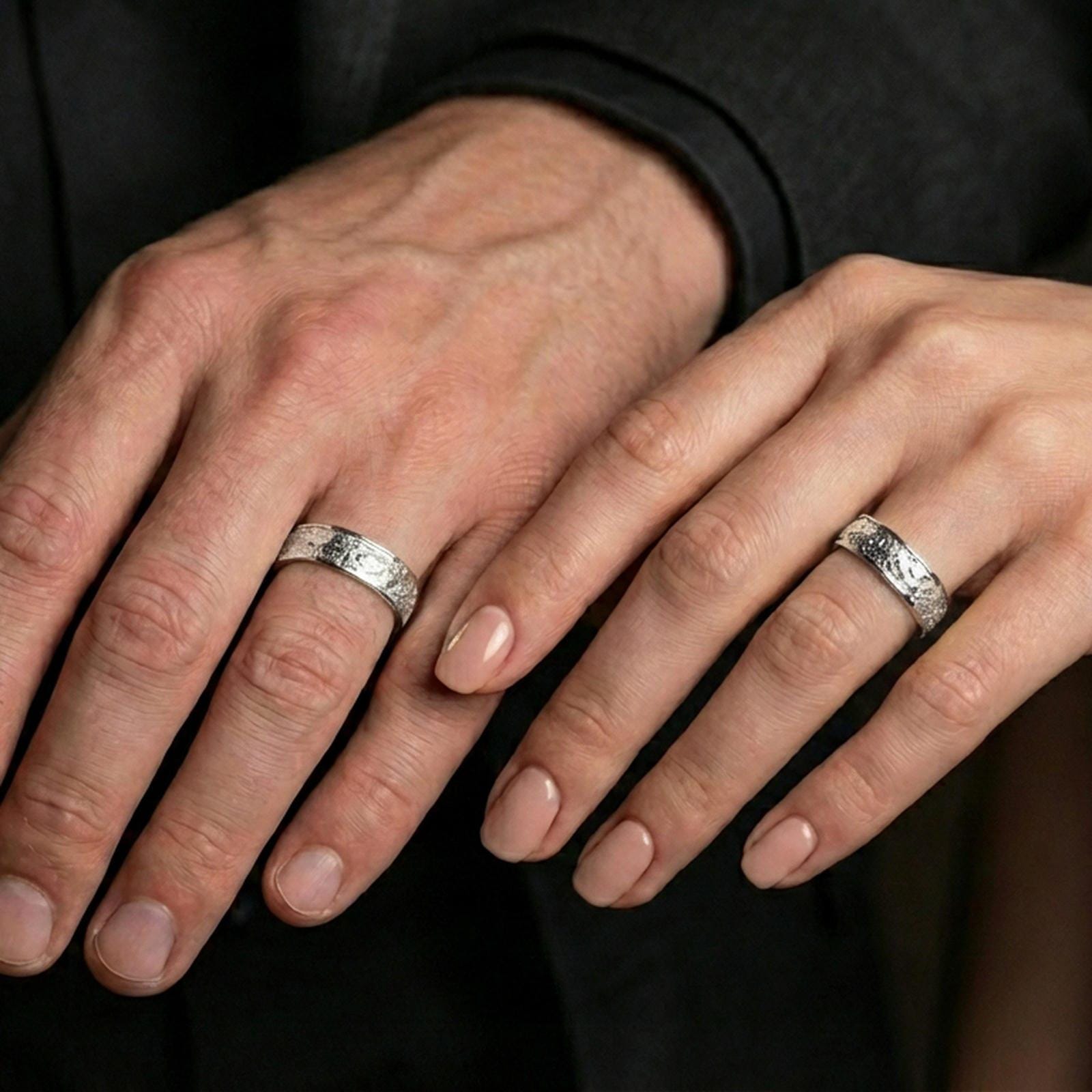 Polished silver bark texture band ring worn on the finger, lifestyle shot highlighting modern clean wear, reflective finish, and tactile bark texture presence.