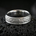 Load image into Gallery viewer, Polished silver bark texture band ring on volcanic stone, crisp macro photo emphasizing bright shine, clean edges, and organic bark-like texture detail.
