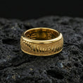 Load image into Gallery viewer, Gold plated lizard skin spinner ring on volcanic stone, premium macro shot capturing warm gold tone across the reptile texture with clear focus on the spinning layer.
