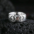 Load image into Gallery viewer, Polished silver Greek sculpture ring on volcanic stone, sharp macro shot emphasizing clean reflective edges, crisp cameo relief, and premium craftsmanship.
