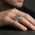 Load image into Gallery viewer, Polished silver guitar ring worn on the finger, lifestyle shot highlighting sleek shine, modern musician style, and everyday wear versatility.
