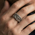 Load image into Gallery viewer, Oxidized sterling silver dragon cloud band ring worn on the finger, lifestyle image showing bold mythic presence and high-relief texture in natural light.
