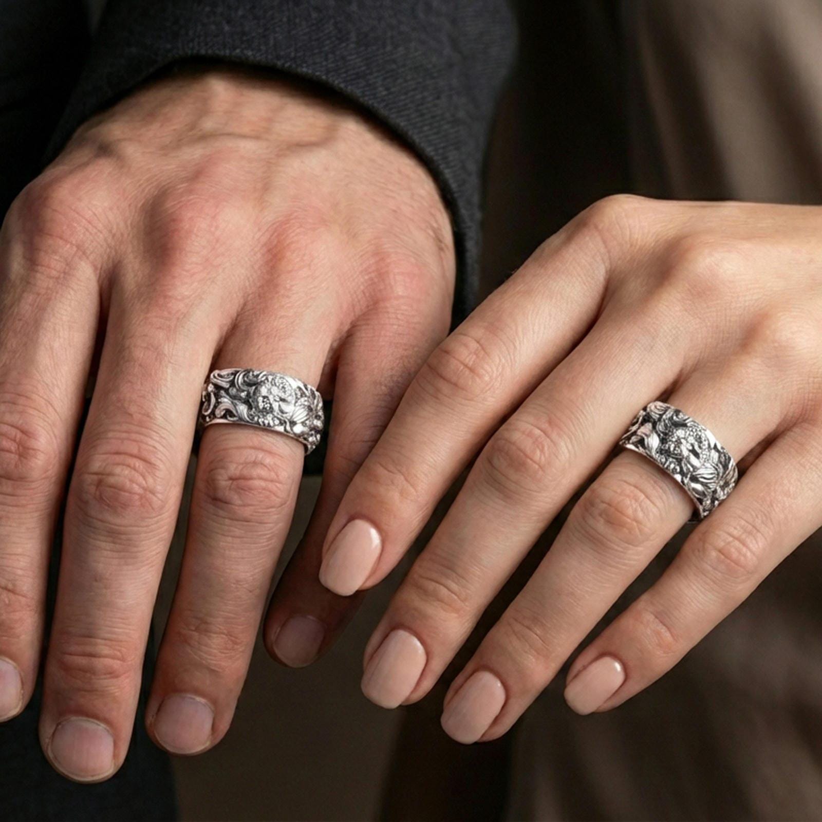 Polished silver guardian lion band ring worn on the finger, lifestyle photo showing a sleek shine with sharp relief depth and premium sculptural presence.